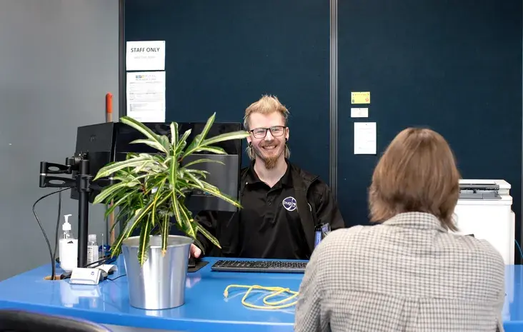 Customer service interaction at office counter