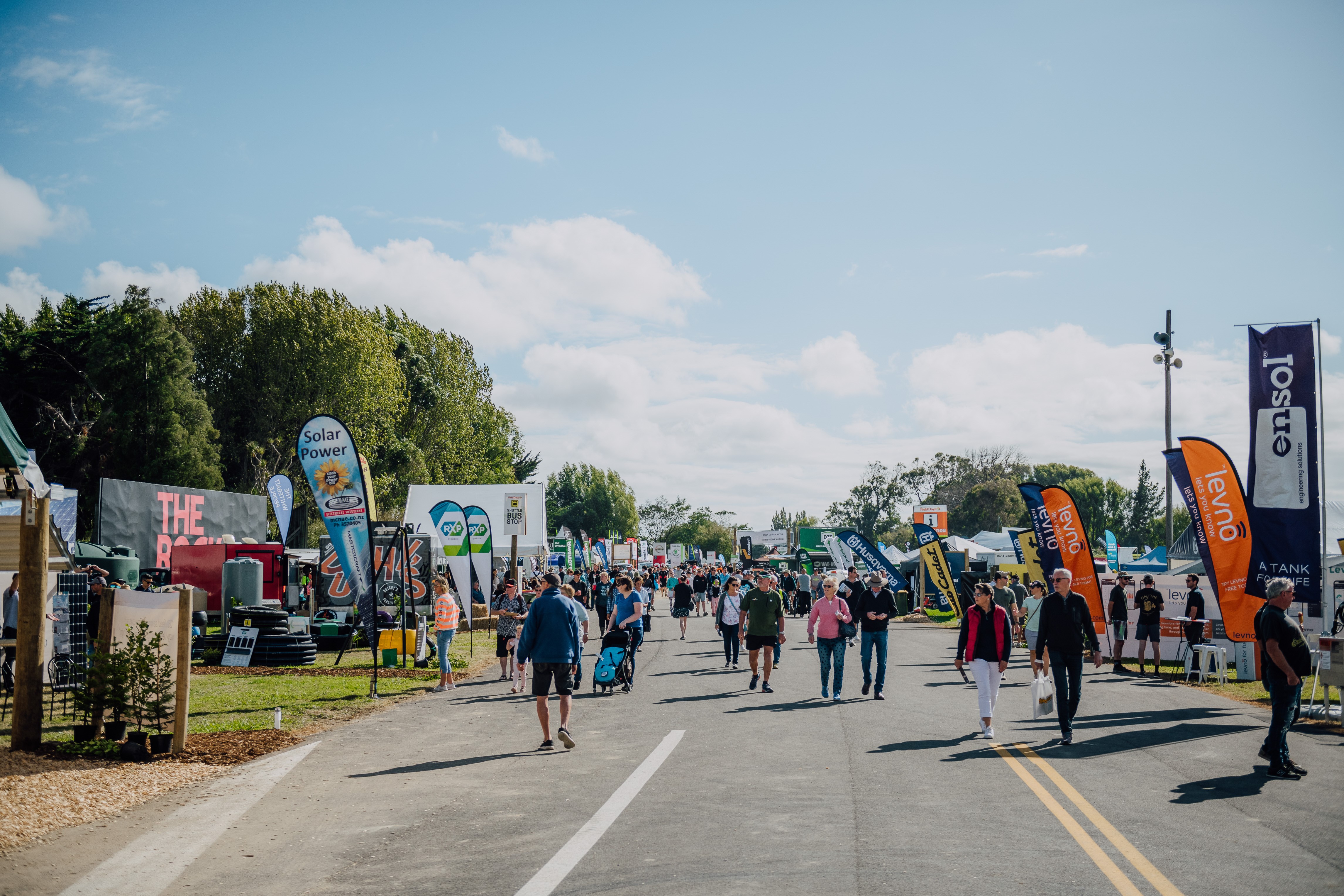 The crowd walking past several stalls at Field Days 2023.